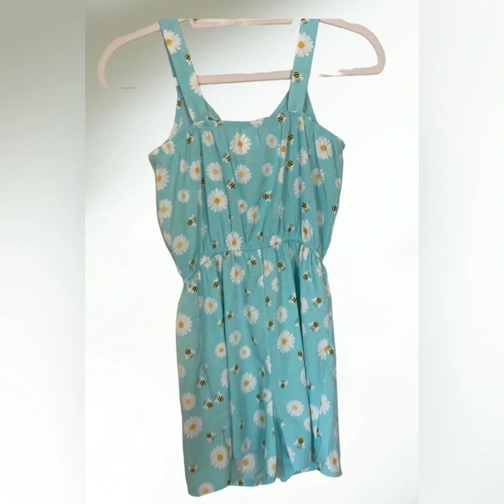 Lily Bleu Short romper in light blue aqua with white flowers and tie front.